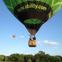 green flying hot air balloon